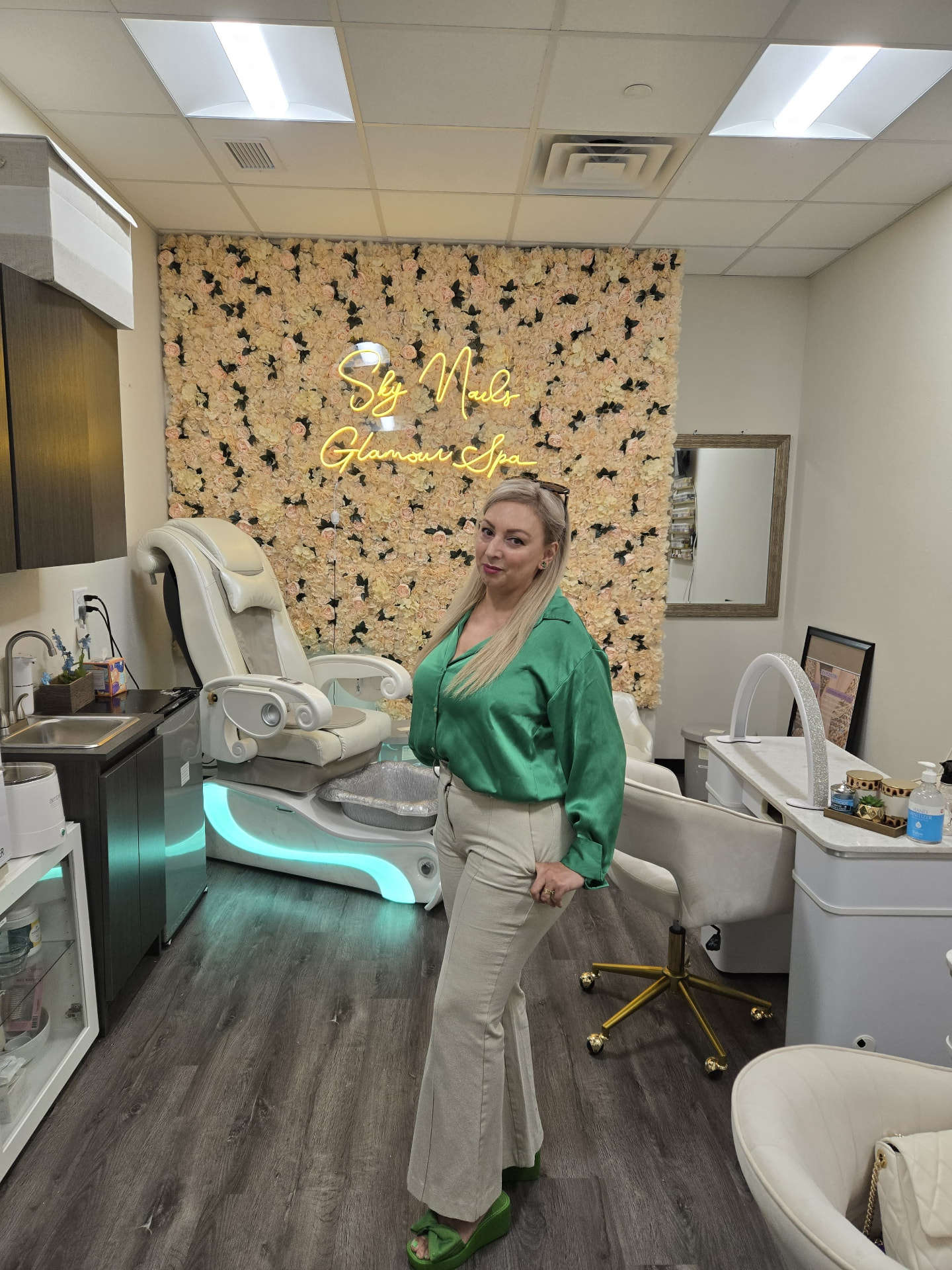 Owner of Sky Nails Glamour Spa in the salon interior